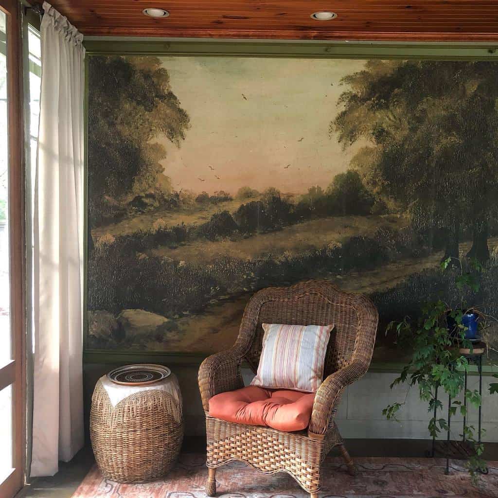 large canvas outdoor scene in sunroom with wicker furniture