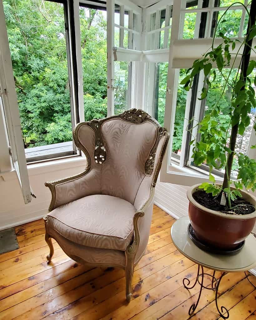 vintage chair in corner of sunroom