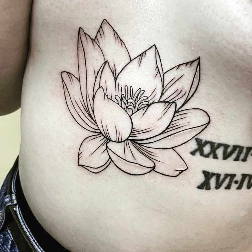 A simple black line water lily tattoo on the side of the ribcage, featuring clean, minimalist outlines and subtle shading, positioned next to Roman numerals