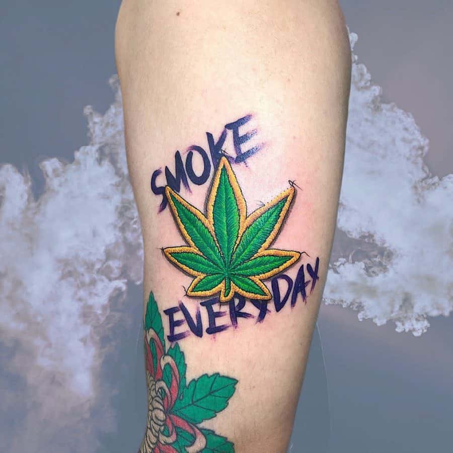 Stitch-inspired tattoo of a marijuana leaf with realistic thread-like textures and the phrase 'Smoke Every Day' in bold font.