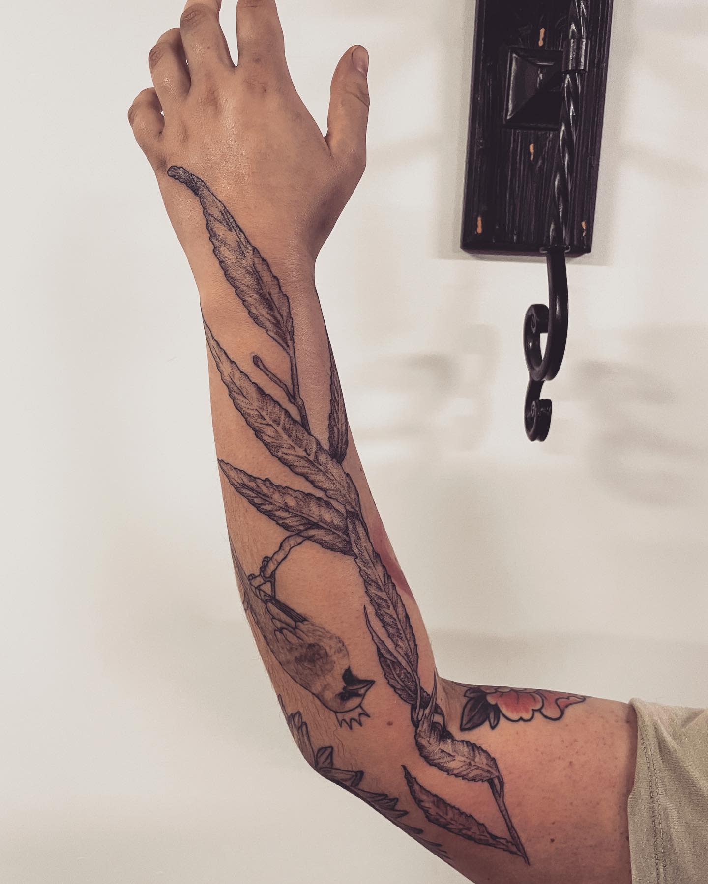 Arm with willow tree leaves tattoo
