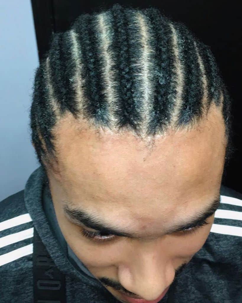 Well Spaced Medium Sized Cornrows Styled From The Front To The Back