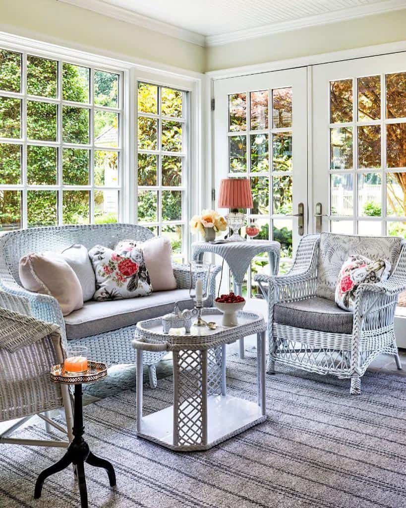 white wicker furniture in large sunroom