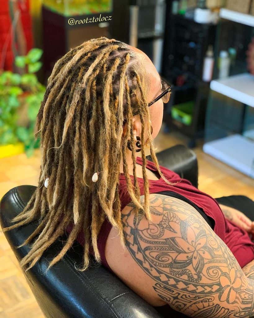 Woman With Dreadlock Hairstyle Featuring Medium Length Dreads