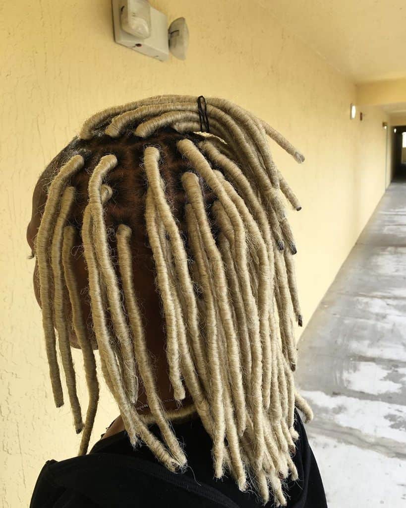 Woman With Dreadlocks With Yarn Wraps Of Different Shades