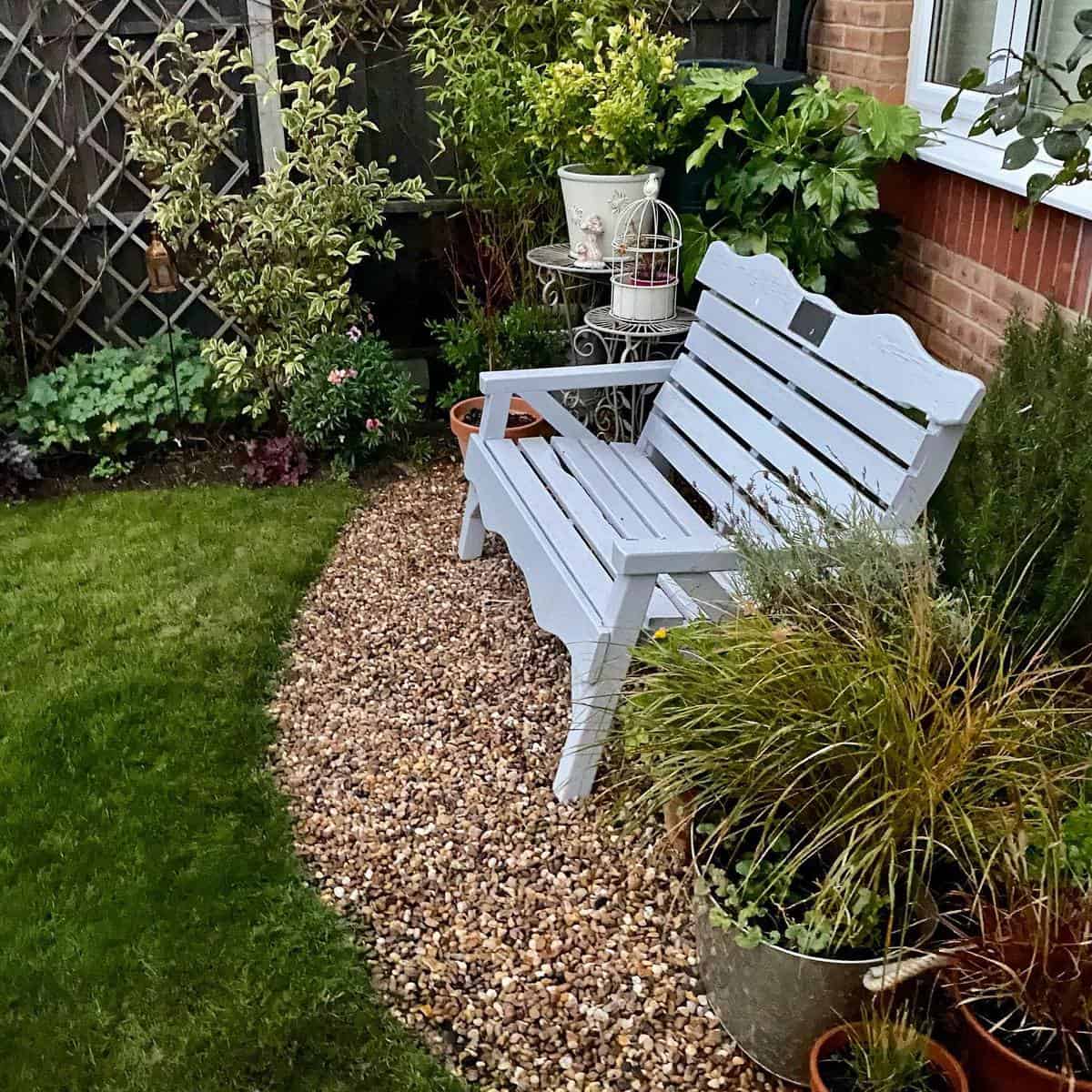 small white wood bench backyard