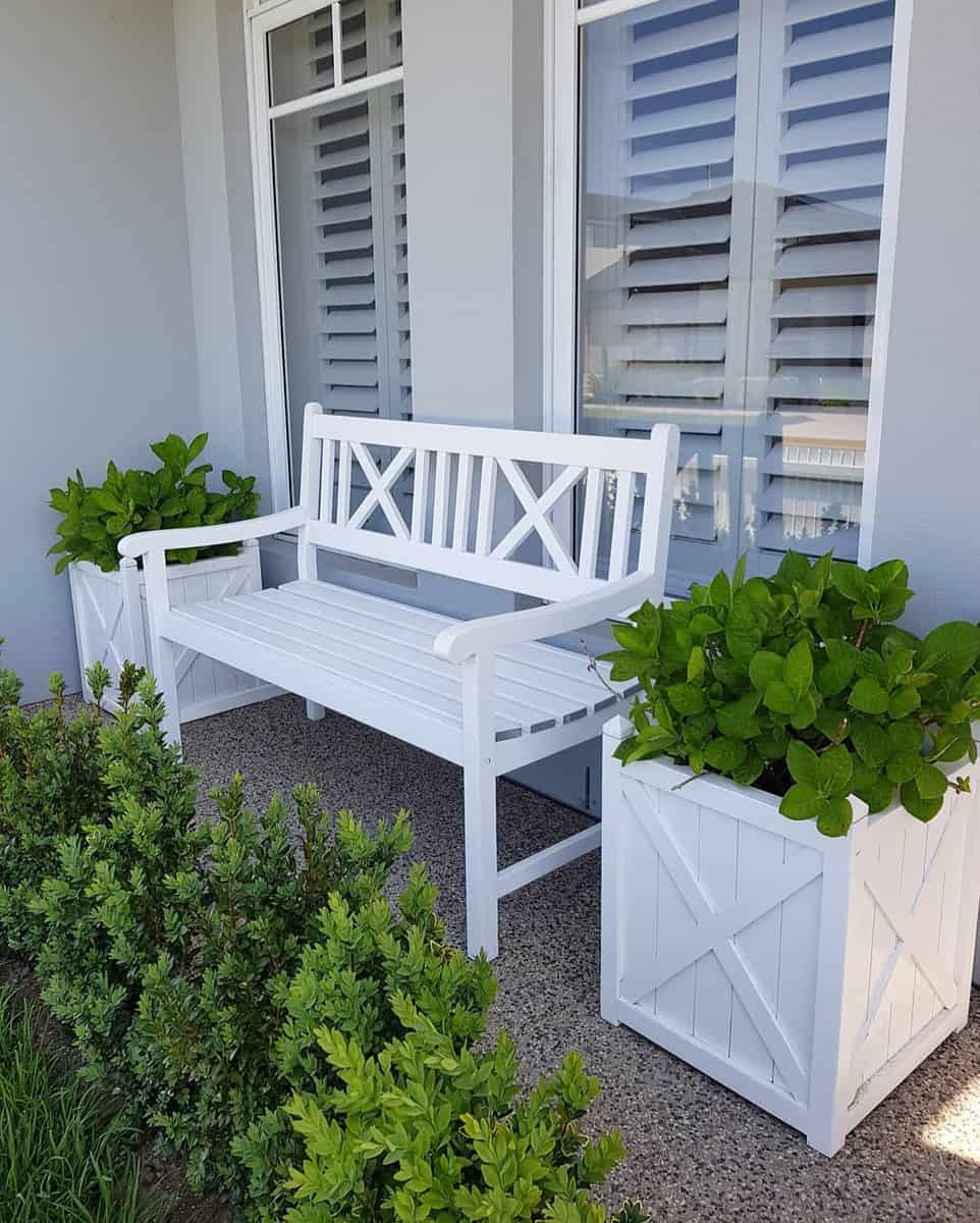 white wood bench and planter boxes