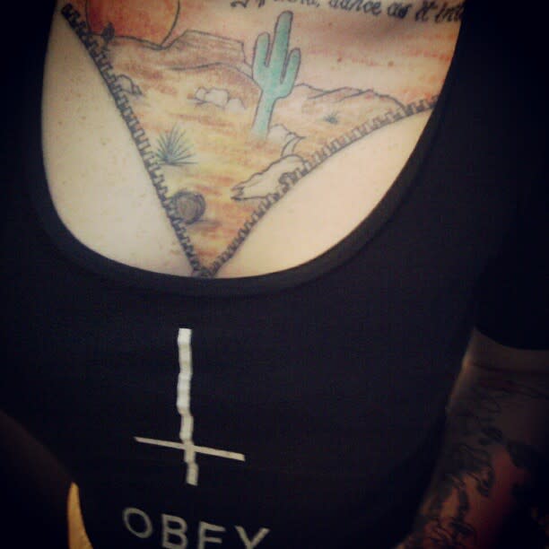 Desert landscape tattoo on the chest