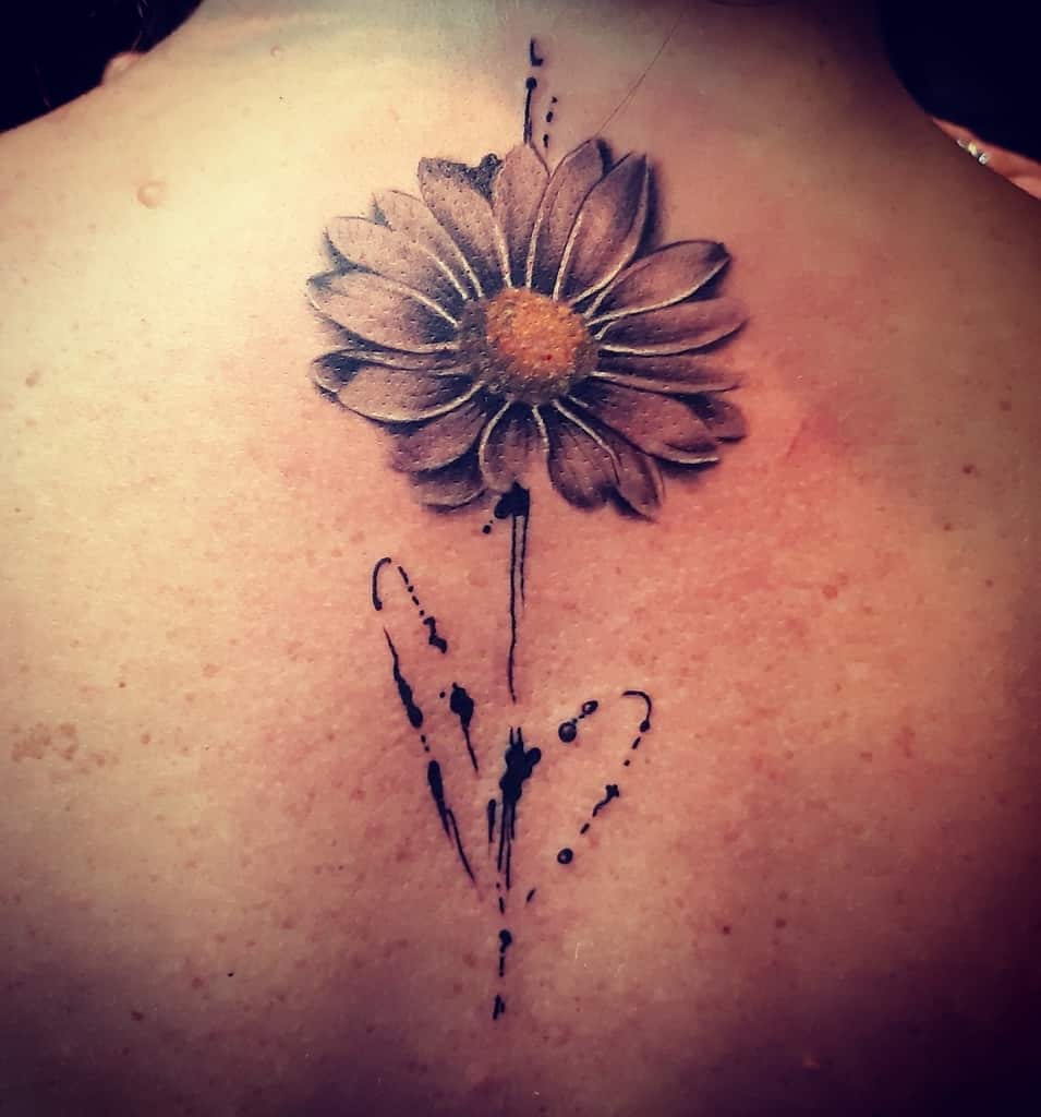 Center back tattoo large abstract color daisy