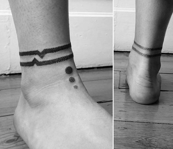 Ankle band tattoo with abstract lines and dots geometric design on man’s ankle