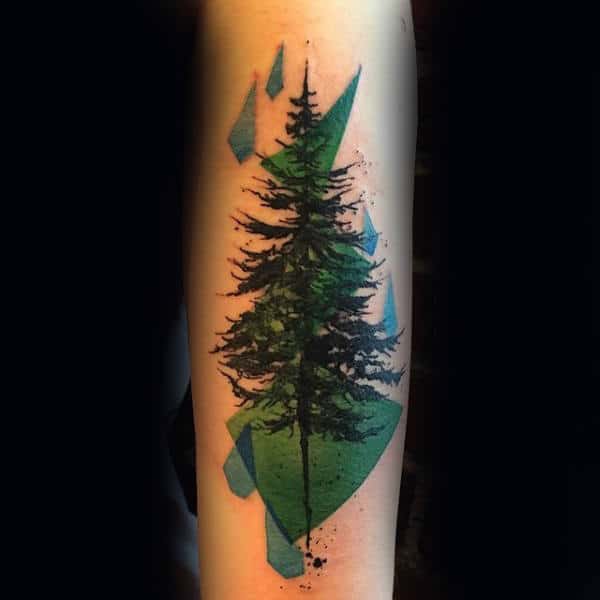 Abstract tattoo of a detailed pine tree with geometric blue and green shapes, blending realism with modern artistic elements.