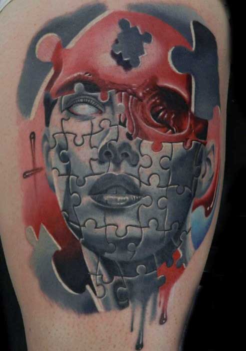 Abstract Mens Thigh Puzzle Piece Tattoo In Blue And Red Ink