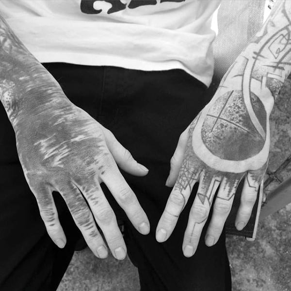 Abstract Negative Space Tattoo Of Circle On Mans Hand