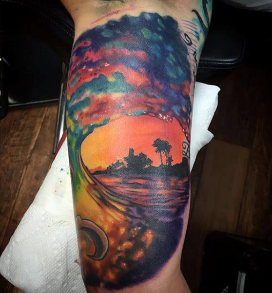 Abstract Ocean Wave And Sunset Bicep Tattoo On Man