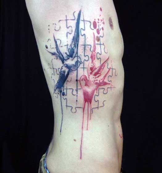 Abstract Puzzle Piece Tattoo For Males With Birds On Rib Cage Side
