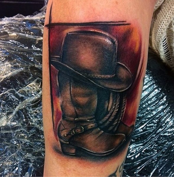 Abstract Watercolor Cowboy Boots And Hat Trash Polka Tattoo On Guy