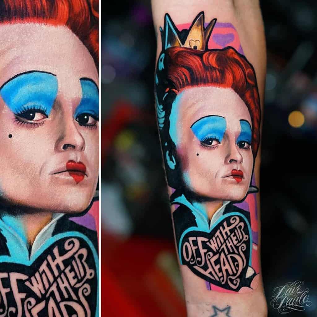 Vibrant Queen of Hearts tattoo featuring bold colors, a crown, and a heart with 'Off with their heads' in stylized lettering