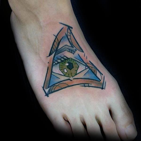 Cubism-style foot tattoo featuring a triangular abstract design with a central green eye and sharp geometric linework.