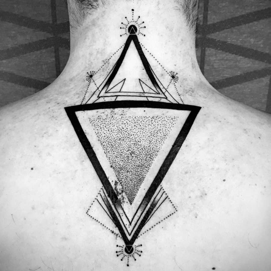 Back tattoo featuring bold geometric triangles with fine dot work and symmetrical line details, creating a modern and minimalist design.