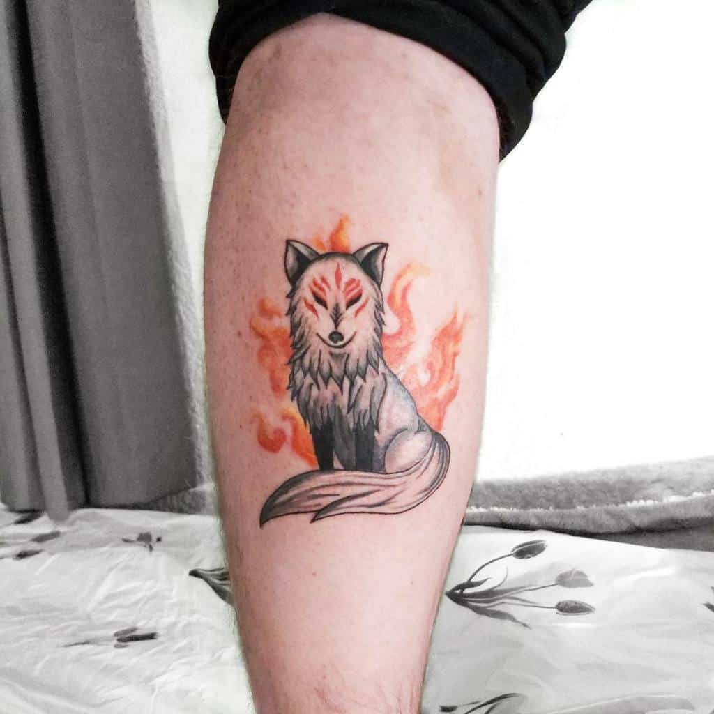 Minimalist Okami tattoo of Amaterasu with fiery accents and soft, radiant energy