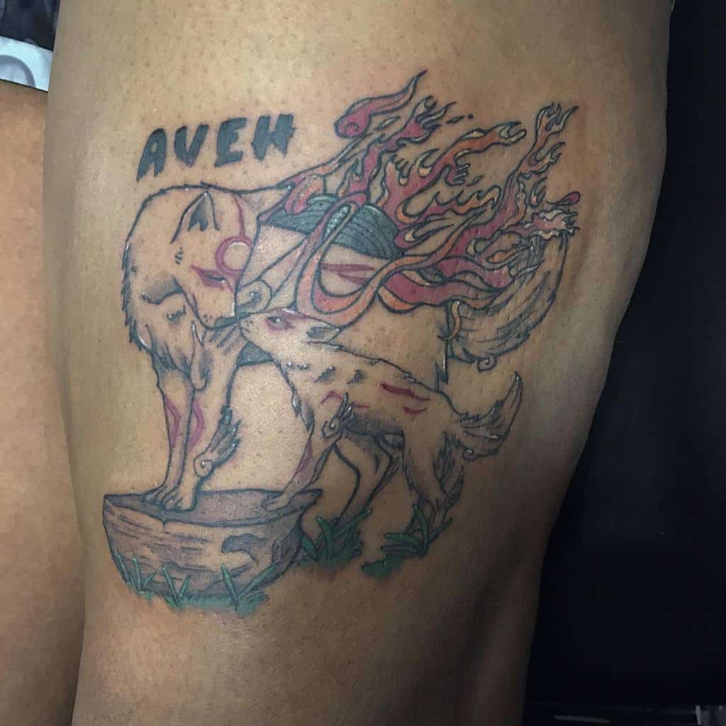 Heartfelt tattoo of Amaterasu with a playful wolf companion, both adorned with celestial energy and vibrant details