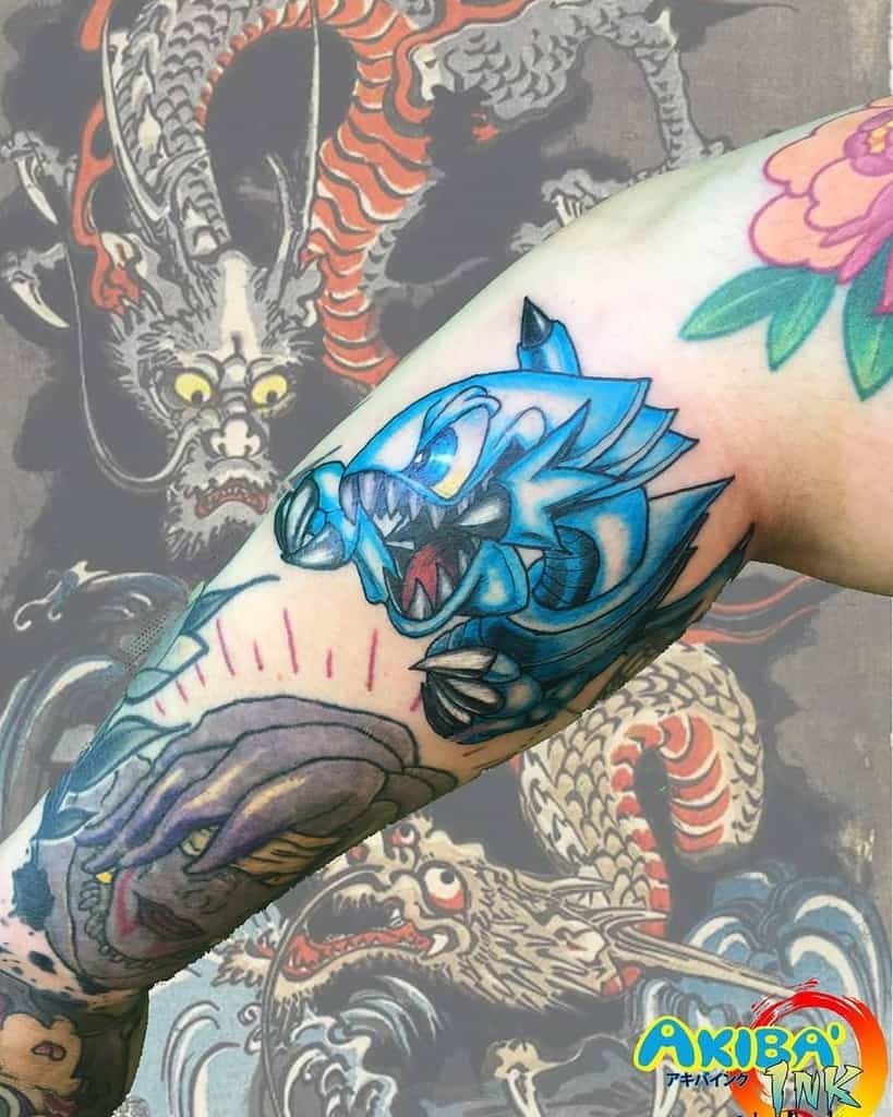 Dynamic tattoo of Amaterasu in a celestial scene, featuring cherry blossoms and iconic flame details