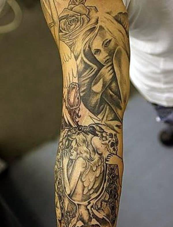 Arm tattoo featuring a woman, rose, and angel within an ornate frame