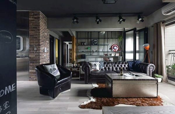 Modern living room with tufted leather sofa, metal coffee table, and exposed brick accents.