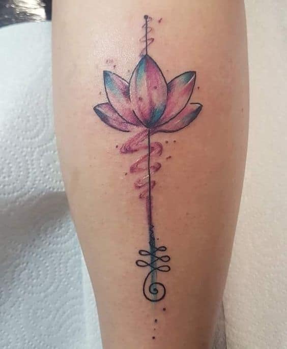 Unalome tattoo with a watercolor lotus on the leg, symbolizing spiritual enlightenment, growth, and the journey toward inner peace.
