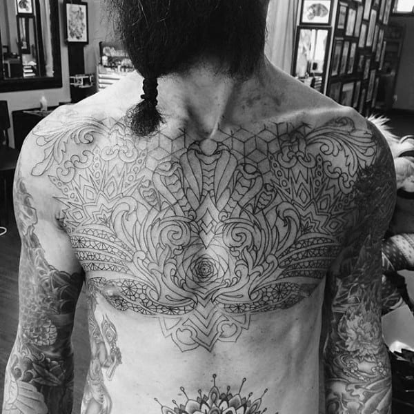 Amazing Filigree Male Chest Tattoo With Black Ink Outline Design