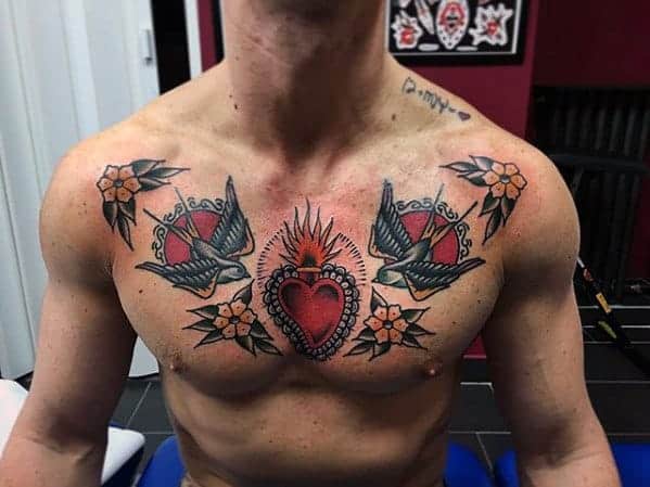 amazing-flaming-heart-with-swallow-birds-guys-traditional-chest-tattoo