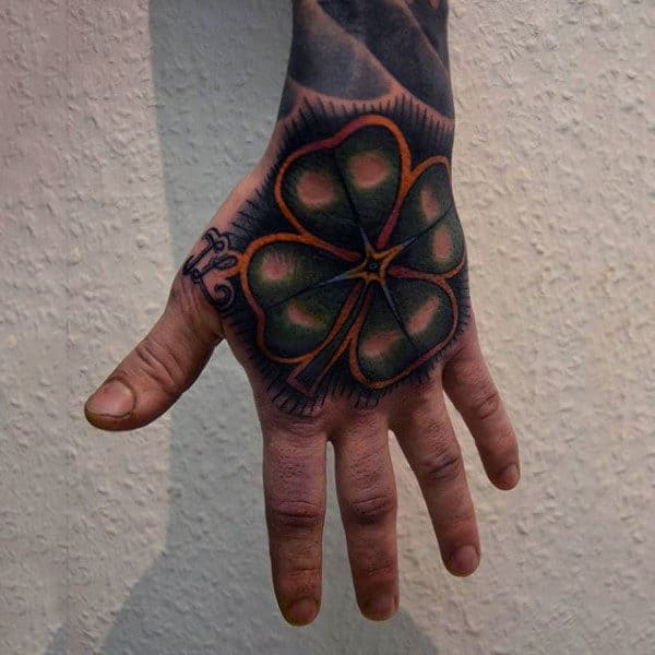 Amazing Four Leaf Clover Hand Tattoo On Man