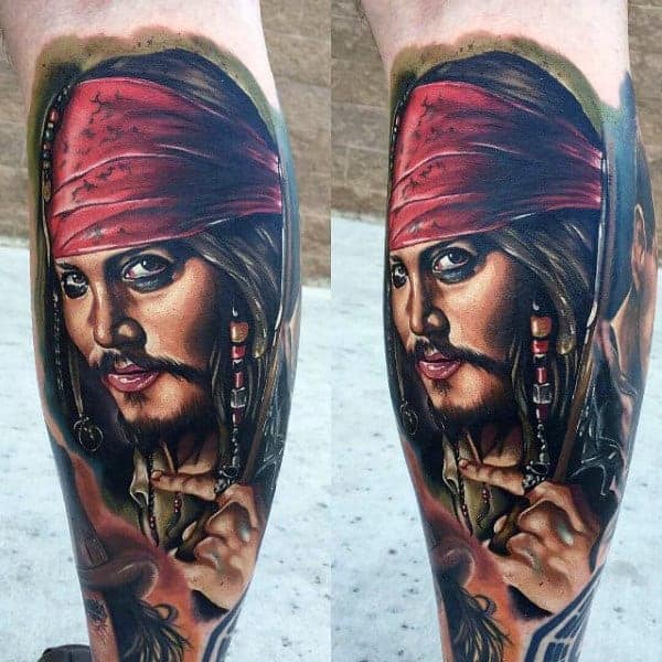 Tattoo of Jack Sparrow with a red bandana and beads, depicted on a leg
