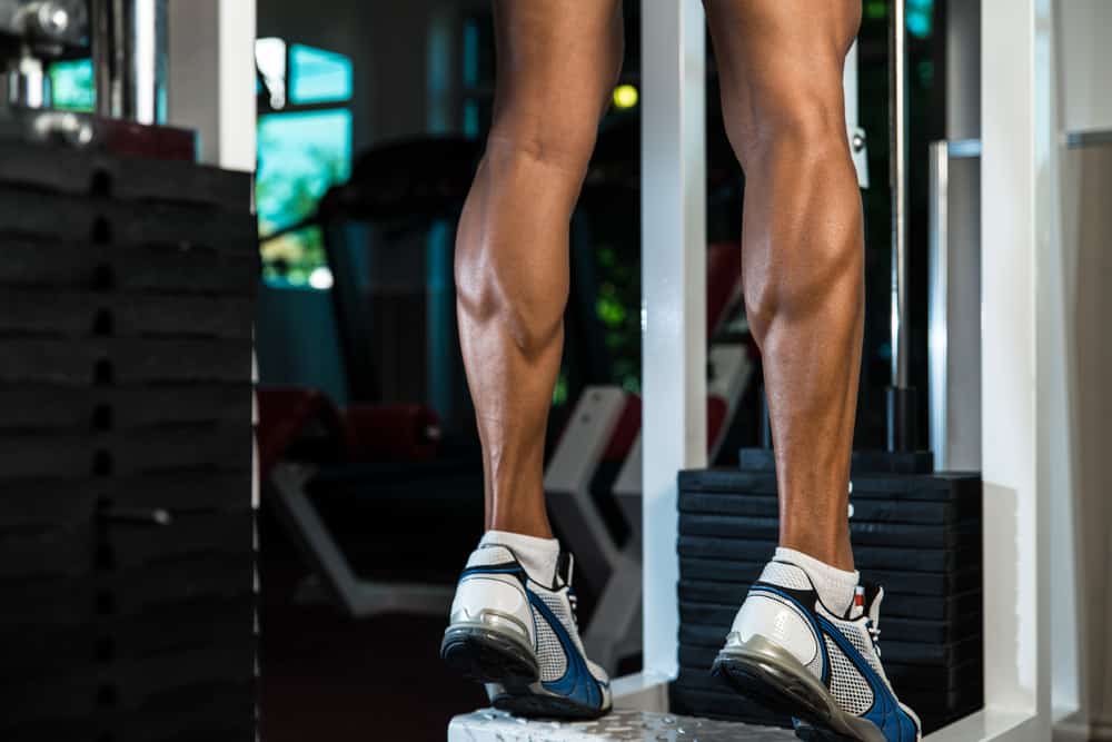 young man amazing legs in gym