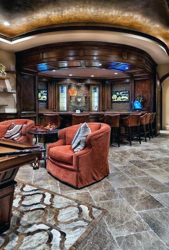 luxury man cave basement red lounge chairs dining room table 