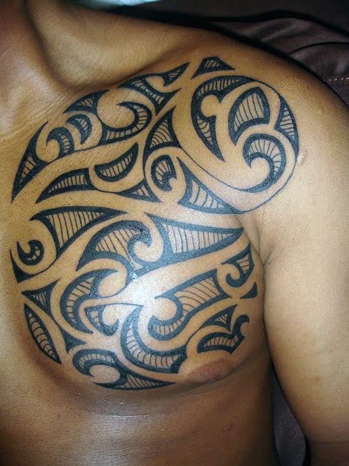 Amazing Male Chest Tribal Tattoo Designs