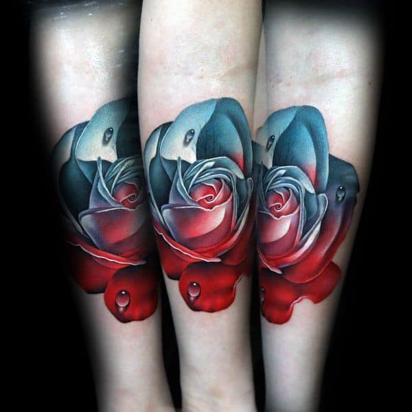 Colorful rose tattoos on forearms with realistic water droplets