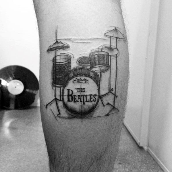 Sketch-style tattoo of a Ludwig drum kit with "The Beatles" logo on the bass drum, paying tribute to the band's iconic setup.