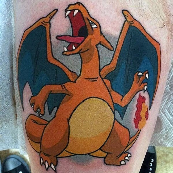Bold Charizard tattoo design with wings spread, mouth open in a roar, and flame burning at the tail’s tip.