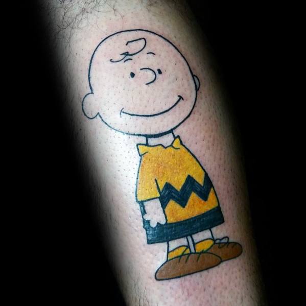 Minimalist Charlie Brown tattoo with bold black outlines and classic yellow outfit, perfect for Peanuts fans seeking nostalgic ink.
