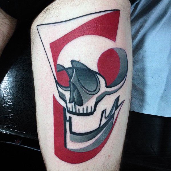 Cubist-style skull tattoo on the arm with bold red and black geometric shapes forming an abstract, modern design.