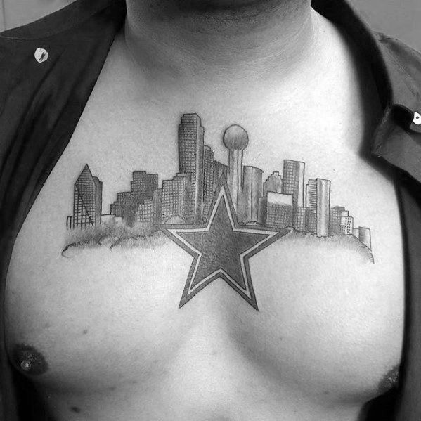 Dallas skyline chest tattoo with a bold star in the center, blending iconic buildings into a shaded black and gray design.