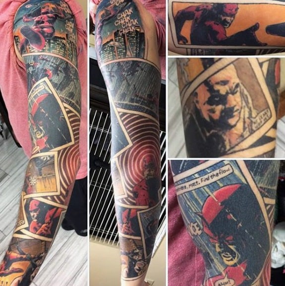 Daredevil comic book sleeve tattoo with detailed panels, bold red and black ink, and striking action and dialogue scenes.