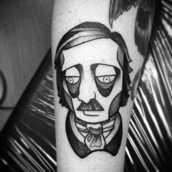 Blackwork tattoo of Edgar Allan Poe with stylized sad eyes, mustache, and bowtie, done in a bold, illustrative style.