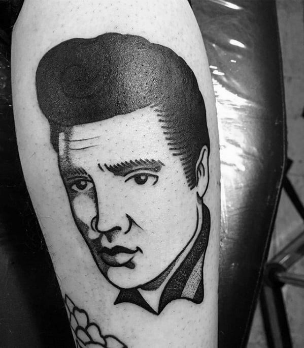 Bold blackwork Elvis Presley tattoo in traditional style, showcasing his slicked-back hair and confident expression.