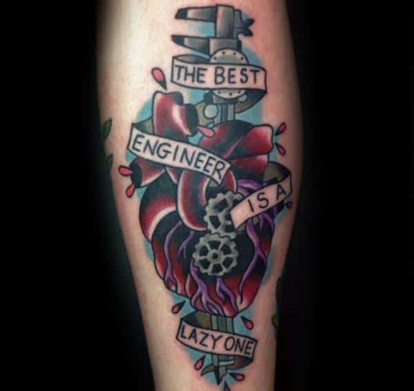 Tattoo of a heart entwined with gears, a caliper, and a ribbon that reads “The best engineer is a lazy one,” in bold, colorful style.