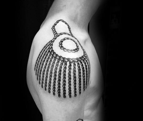 Epaulette tattoo design on upper arm featuring bold braided loops and vertical rope-like strands cascading downward.