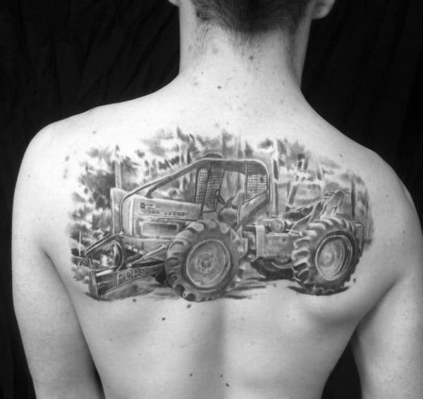 Realistic black and gray back tattoo of a forestry skidder with detailed shading and the word "Pops" subtly engraved on the blade.