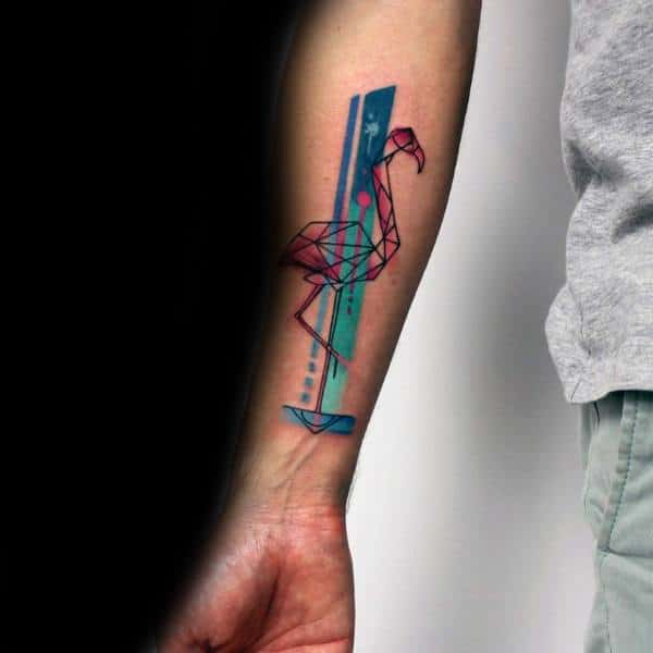 Geometric flamingo tattoo on forearm with vibrant blue and pink watercolor elements, featuring modern, abstract design.