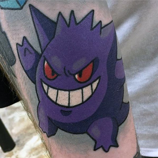 Bold Gengar tattoo design with sharp red eyes and a wide grin, showcasing a classic cartoon-style purple ghost look.